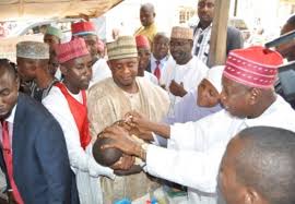 Governor Abdullahi Umar Ganduje Immunising a child