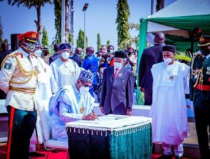 Defense Minister Magashi Watch President Buhari Signs The Rigister